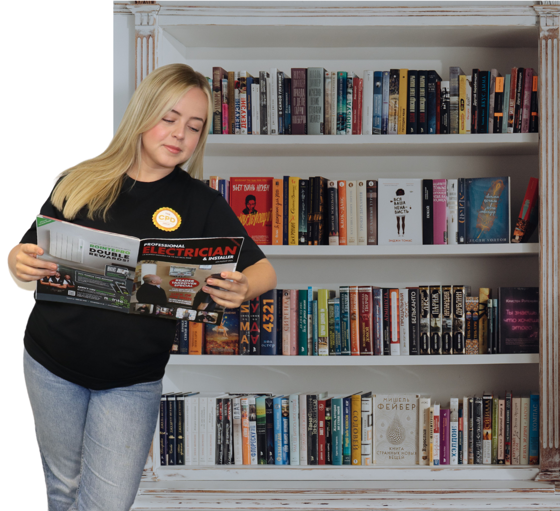 Woman reading next to stack of accredited Edutorials